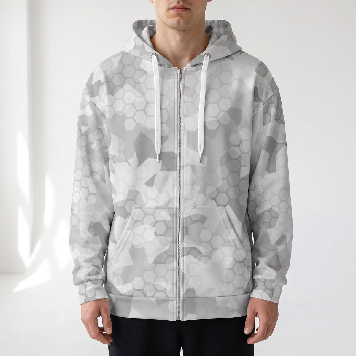 Man wearing the Arctic Shatter winter camouflage zip hoodie, front view