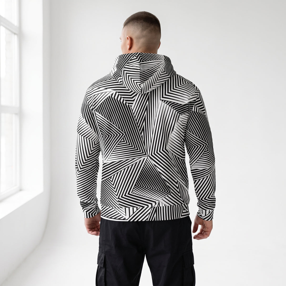 Over-the-shoulder view of the Dazzle naval camouflage zip hoodie