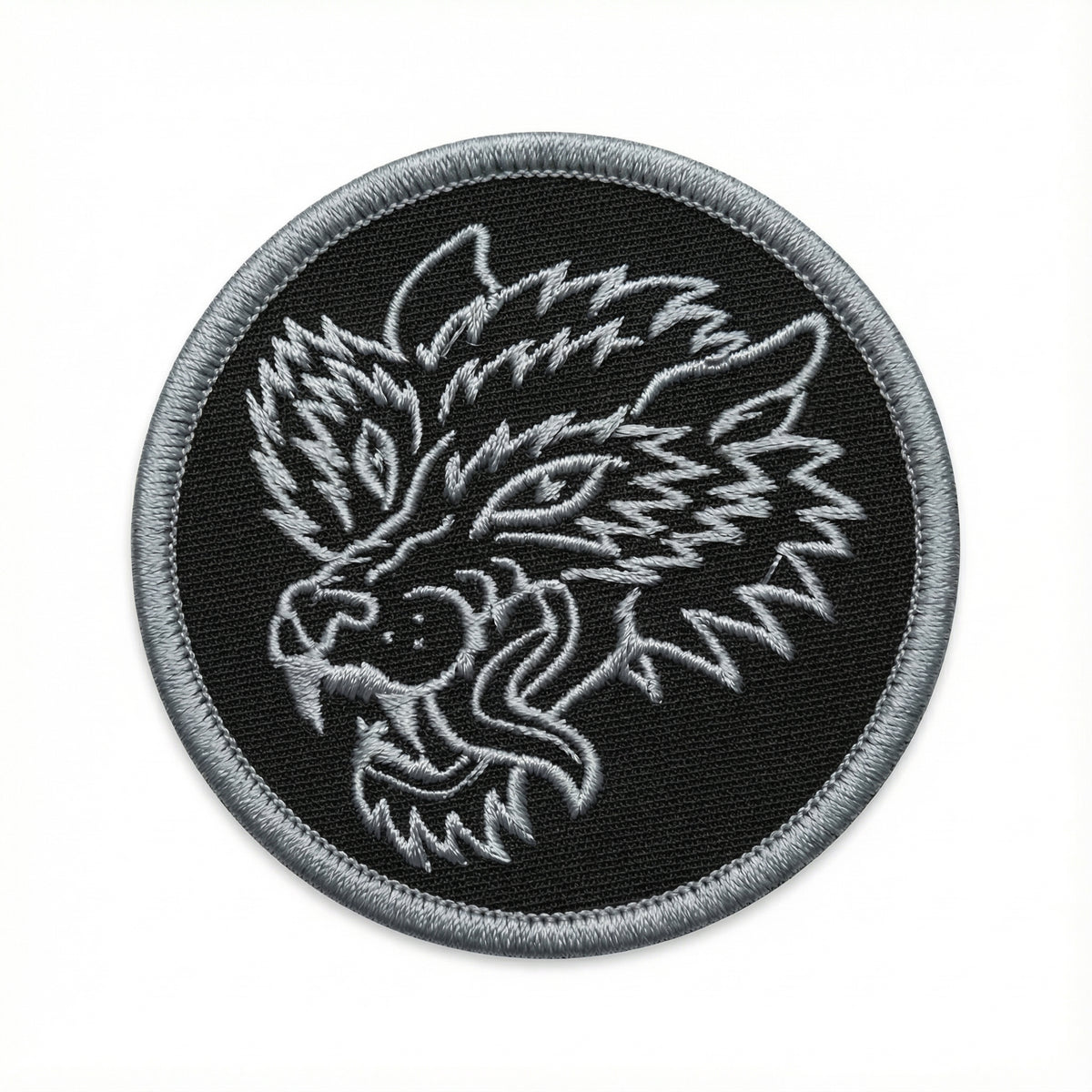 Embroidered patch with a wolf design on a black background