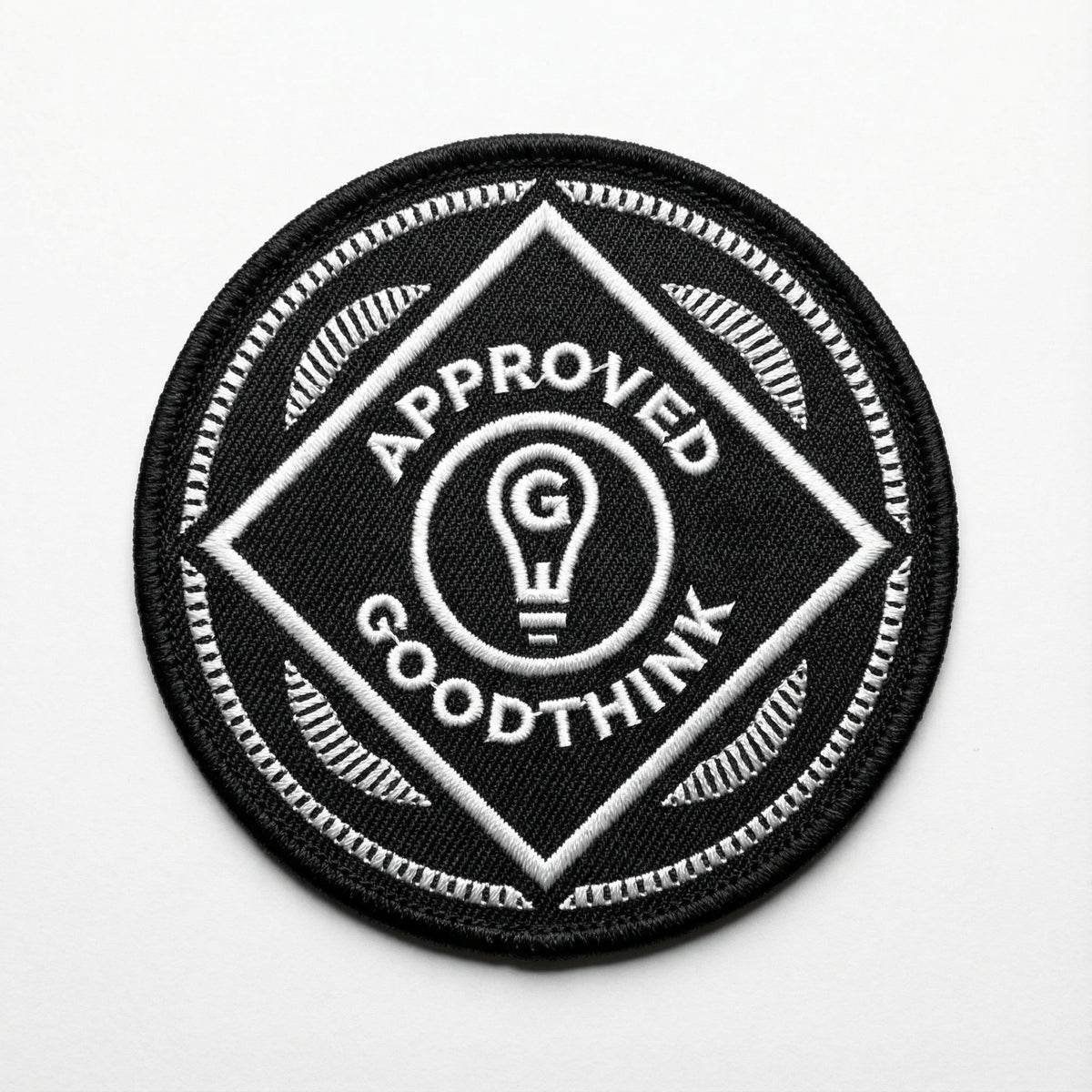 Black and white patch with &#39;Approved Goodthink&#39; text and light bulb symbol on a white background