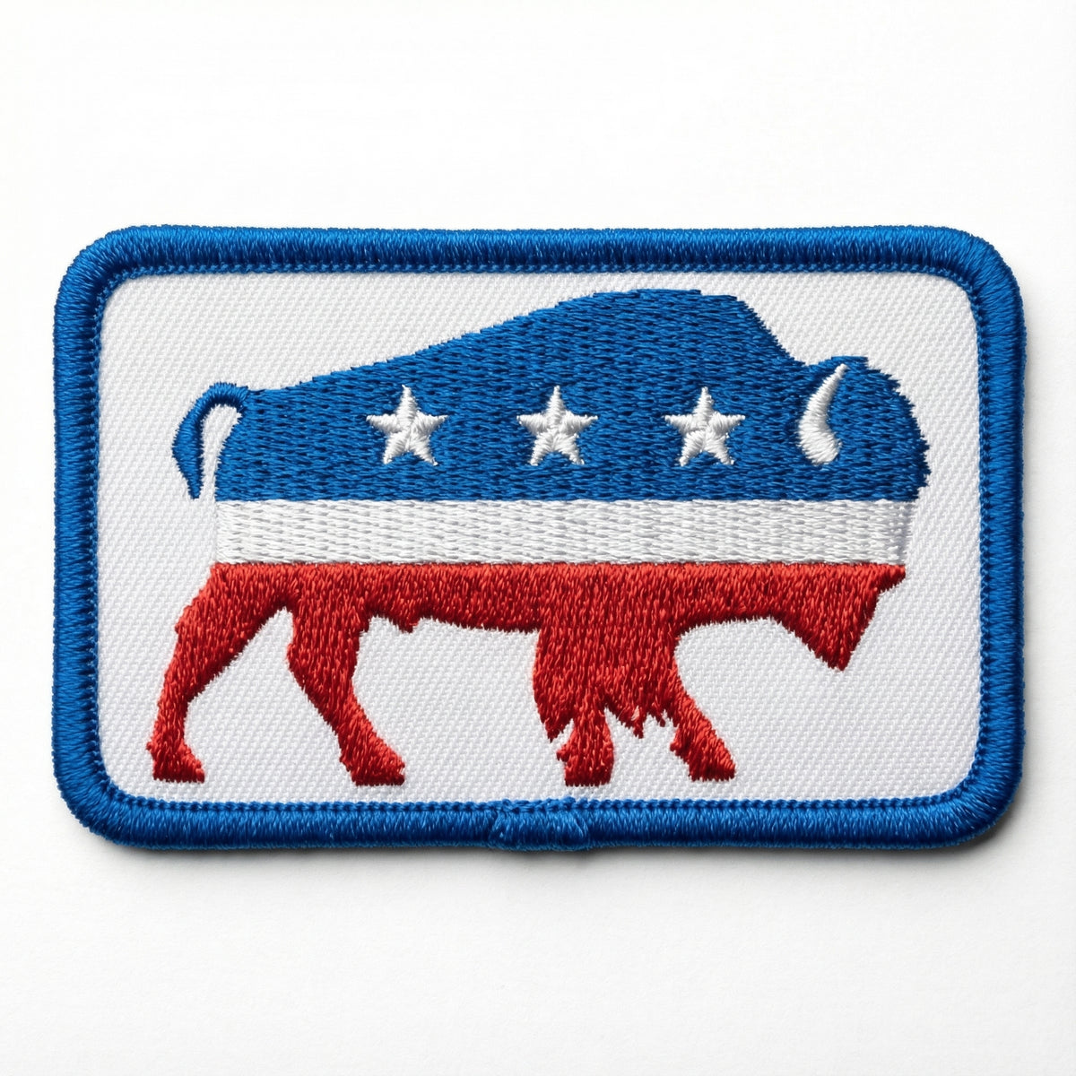 Embroidered patch with a blue and red Liberty Maniacs Bison logo design on a white background