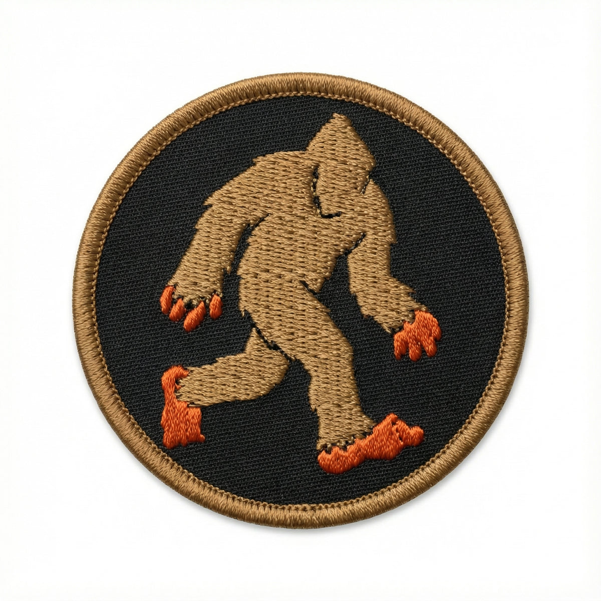 Embroidered patch of a walking bigfoot on a black background