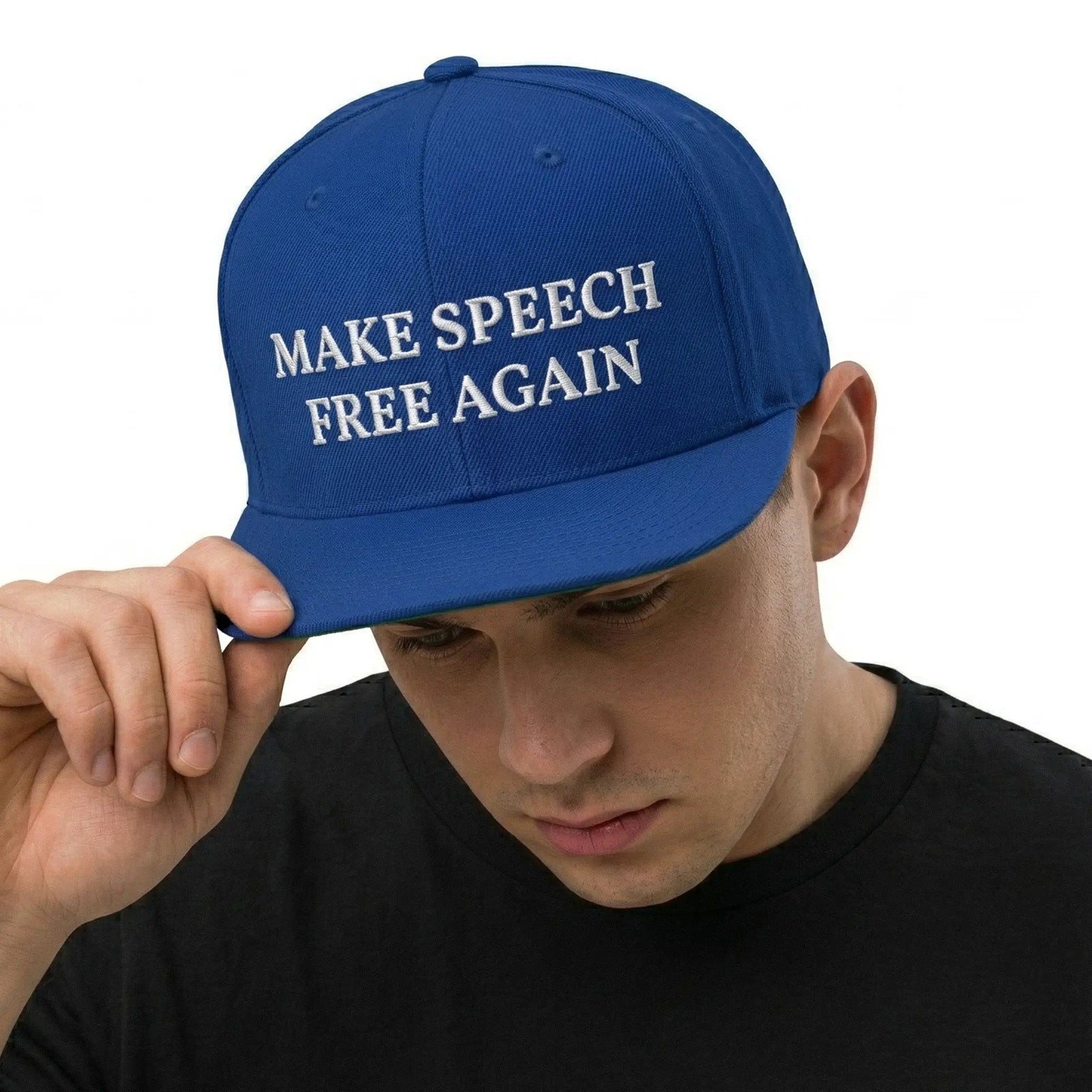 A blue structured snapback hat with the phrase 'MAKE SPEECH FREE AGAIN' embroidered on the front panel.