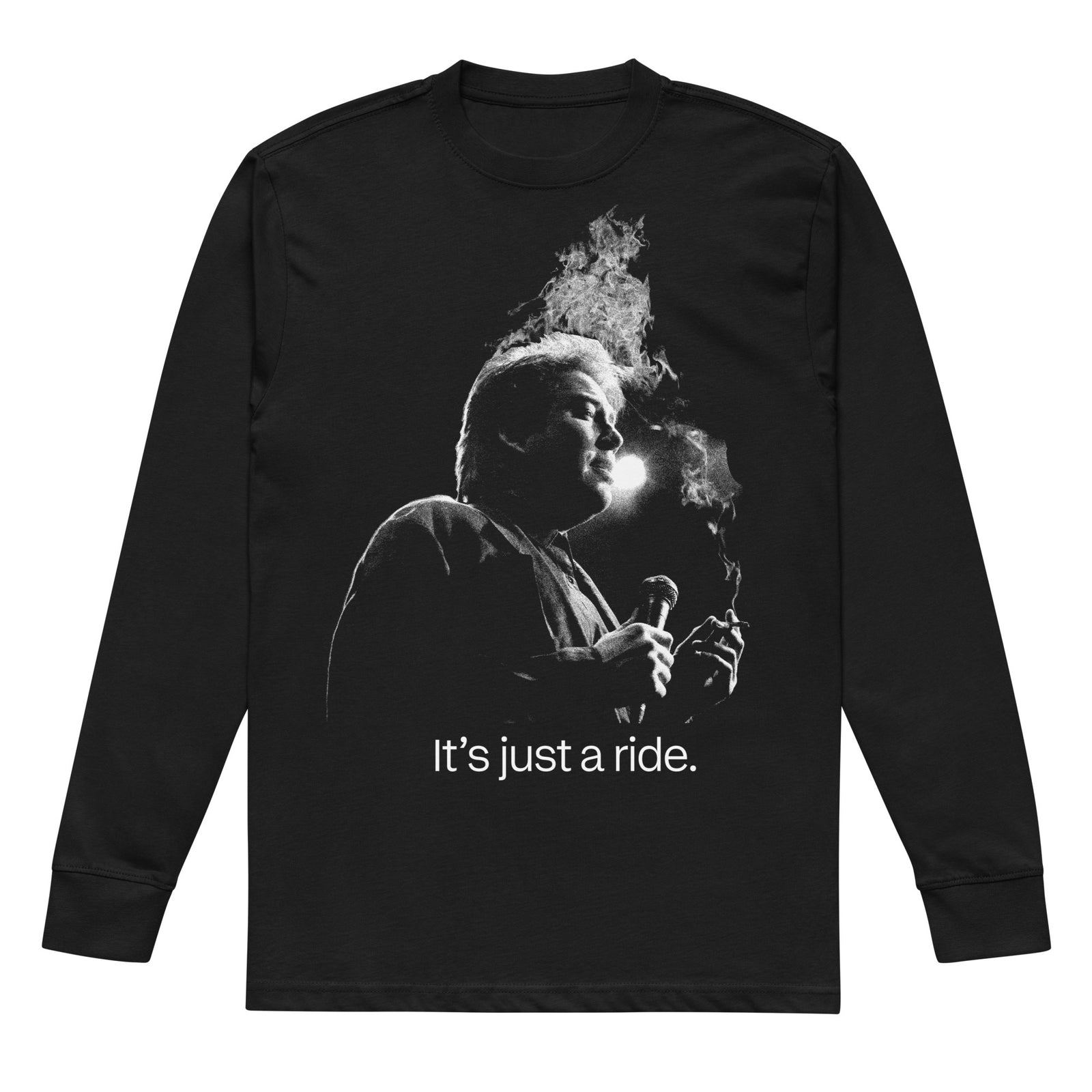A black long-sleeve t-shirt with a white graphic print of Bill Hicks smoking, accompanied by the text 'It's just a ride.' on a solid white background.