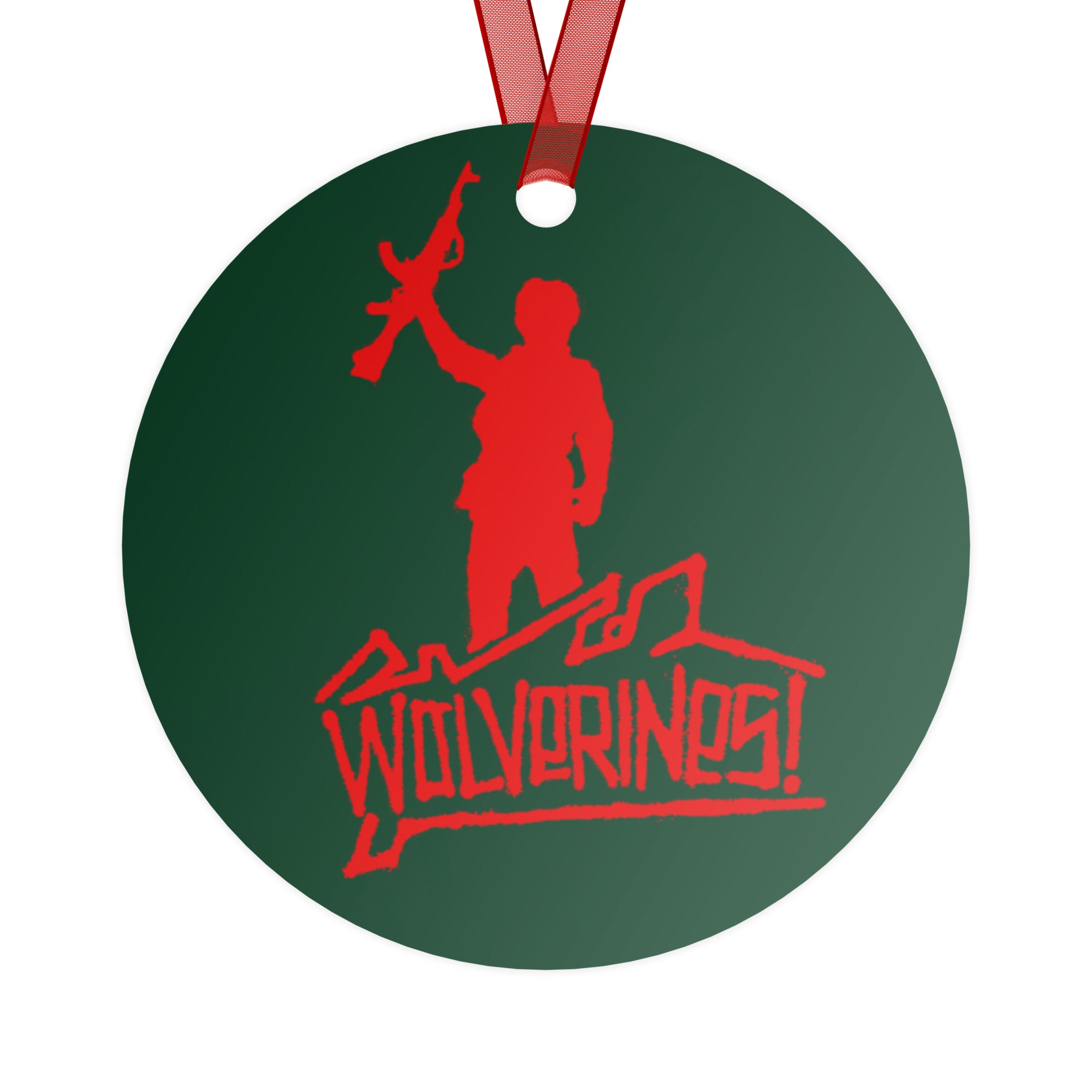 Green ornament with red 'Wolverines!' design on a Christmas tree.