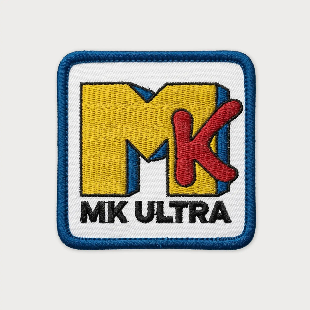 Patch with 'MK Ultra' logo on a white background