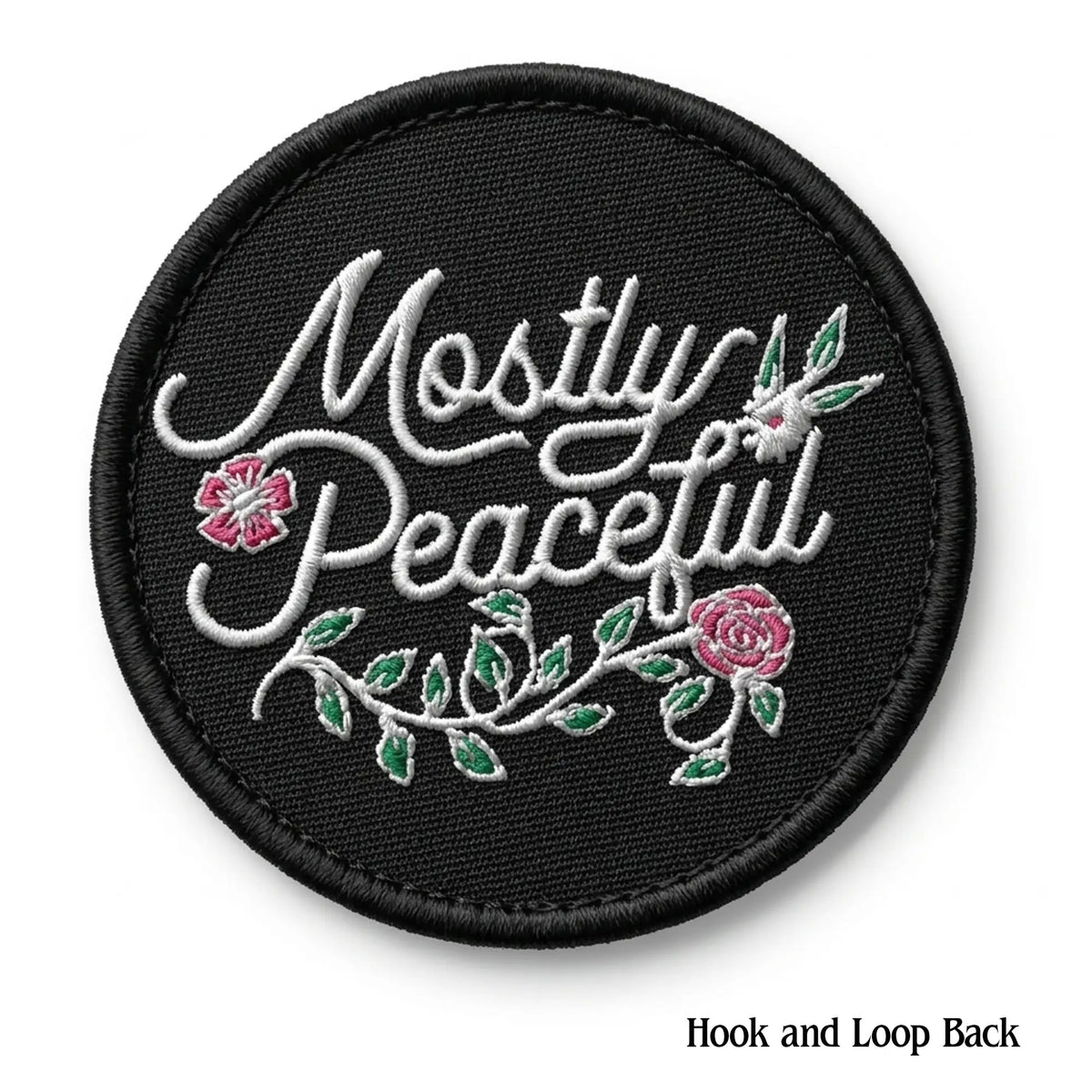 Black patch with 'Mostly Peaceful' text and floral designs on a white background