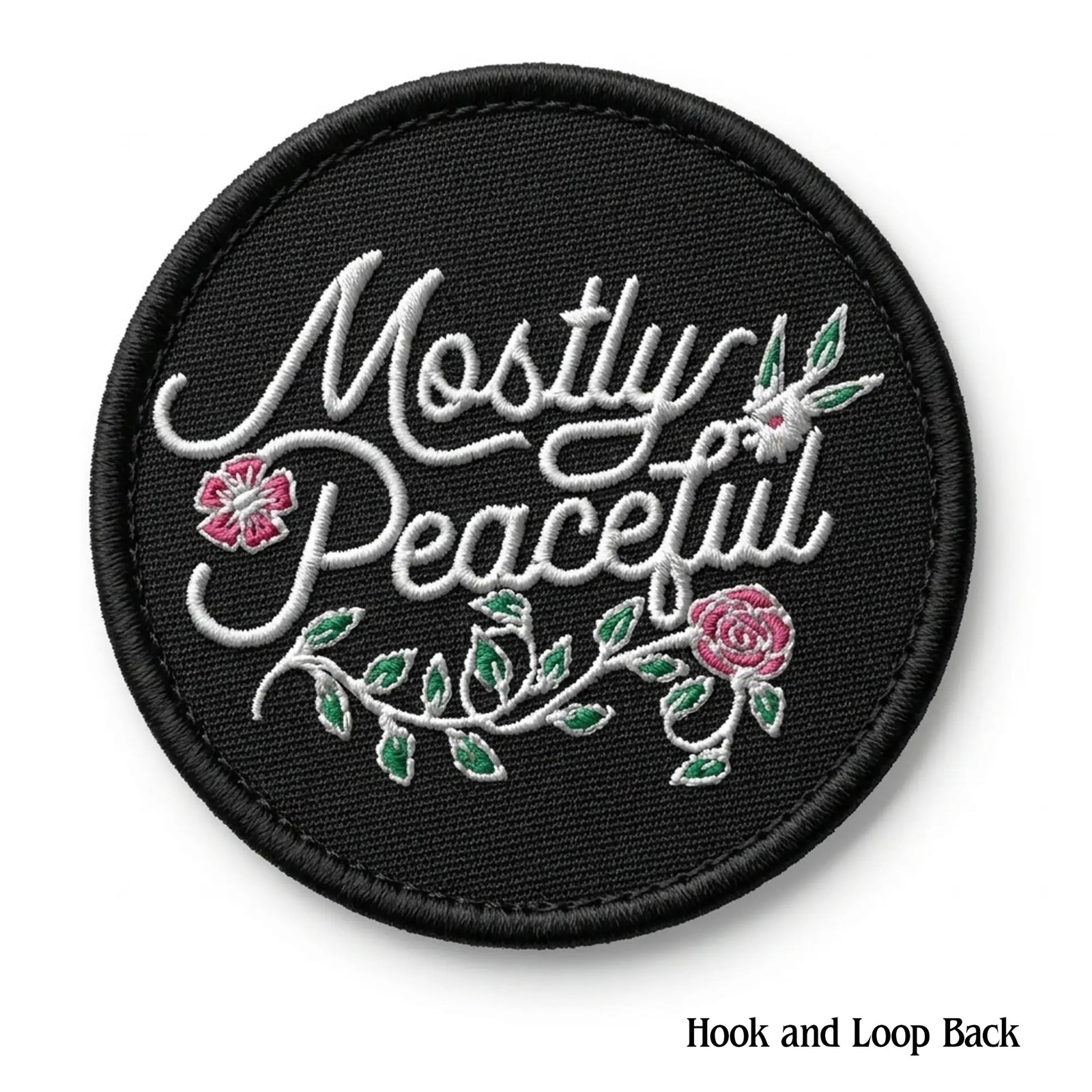 Black patch with 'Mostly Peaceful' text and floral designs on a white background