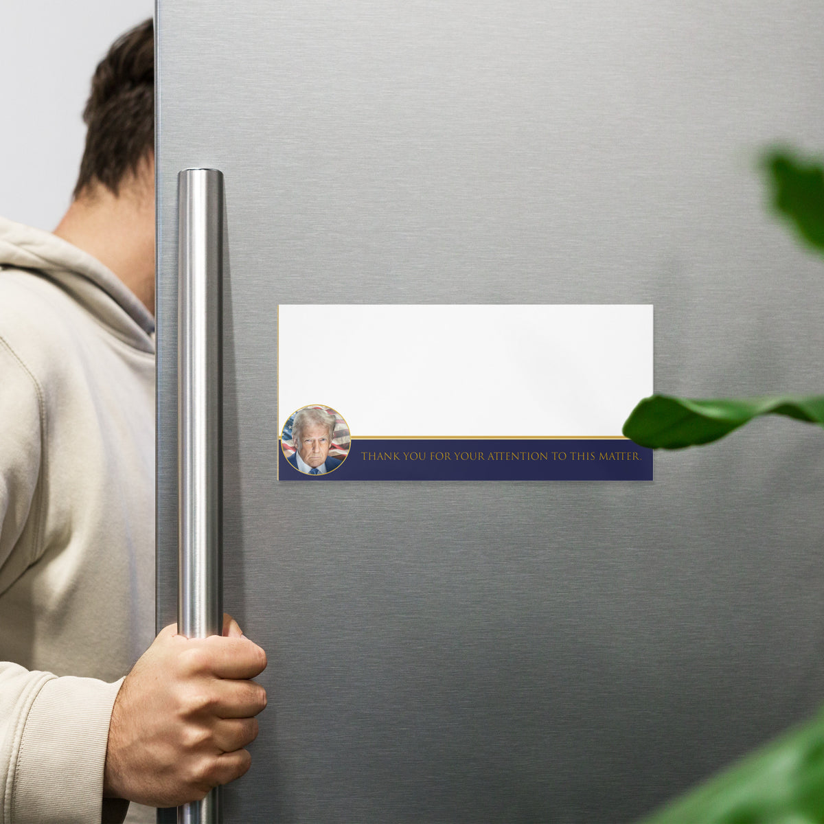 Person opening a refrigerator with a magnet on the door displaying a magnetic notepad with a portrait of Donald Trump that says &quot;Thank You for Your Attention to this Matter&quot; by Liberty Maniacs