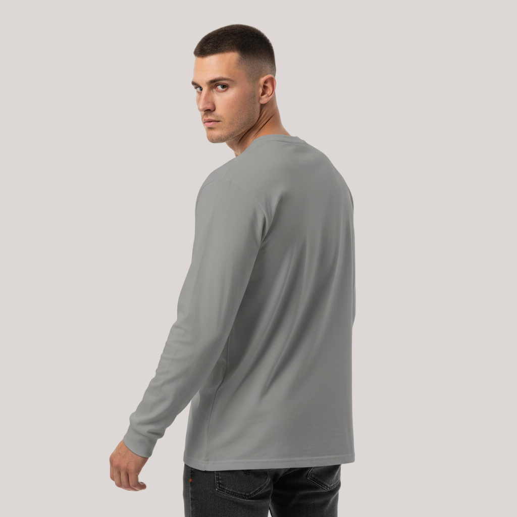 Man wearing a gray Jerusalem Cross Garment-dyed Heavyweight Long-sleeve Shirt