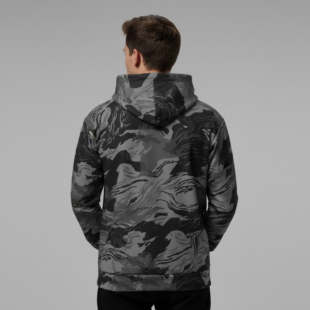 Person wearing a camouflage jacket on a gray background