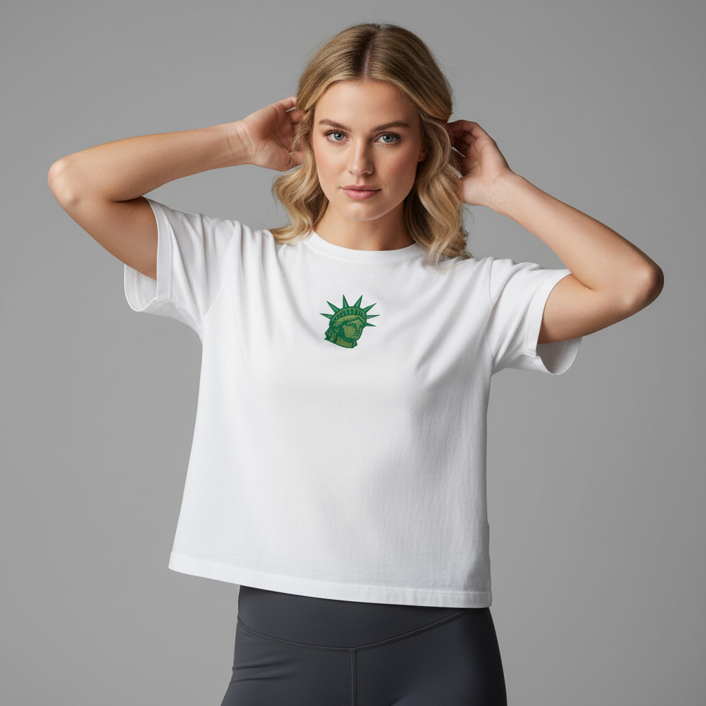 Woman wearing white embroidered Lady Liberty women’s boxy crop tee