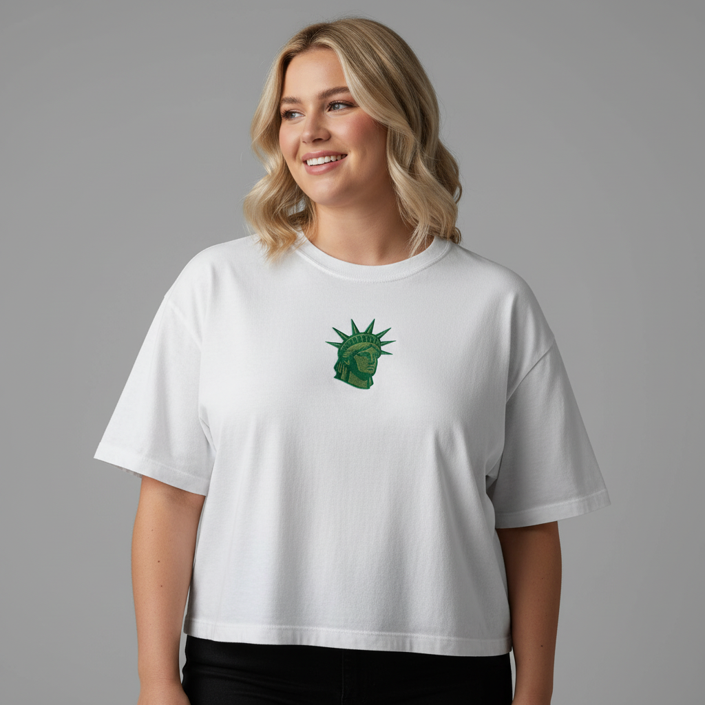 Woman wearing white embroidered Lady Liberty women’s boxy crop tee