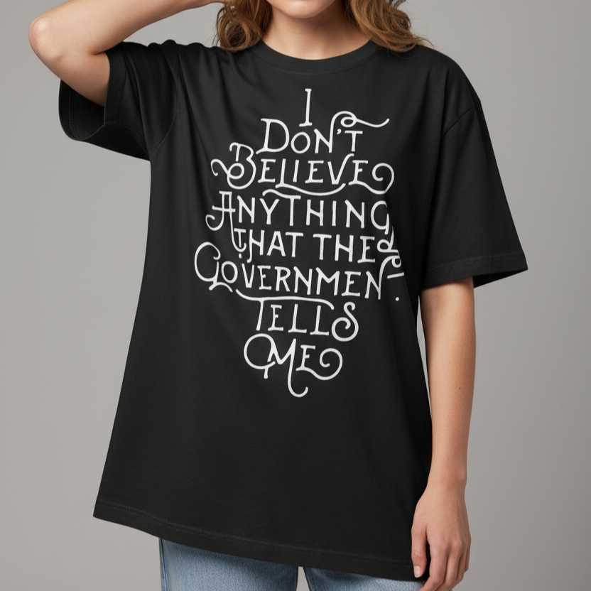 Person wearing a black t-shirt with white text on a gray background