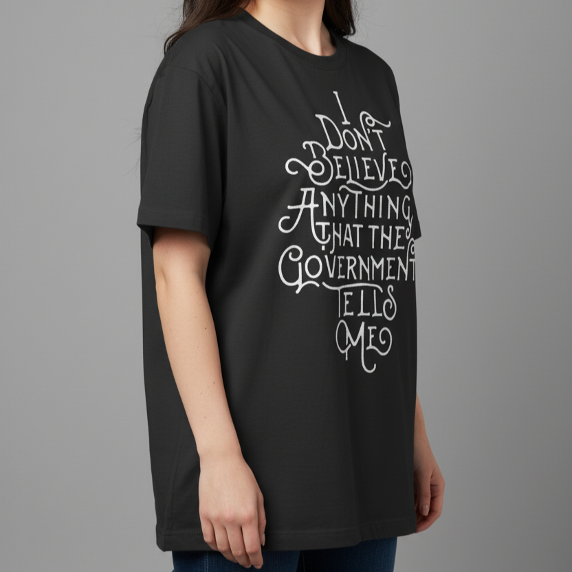 Woman wearing a black t-shirt with white text on a gray background