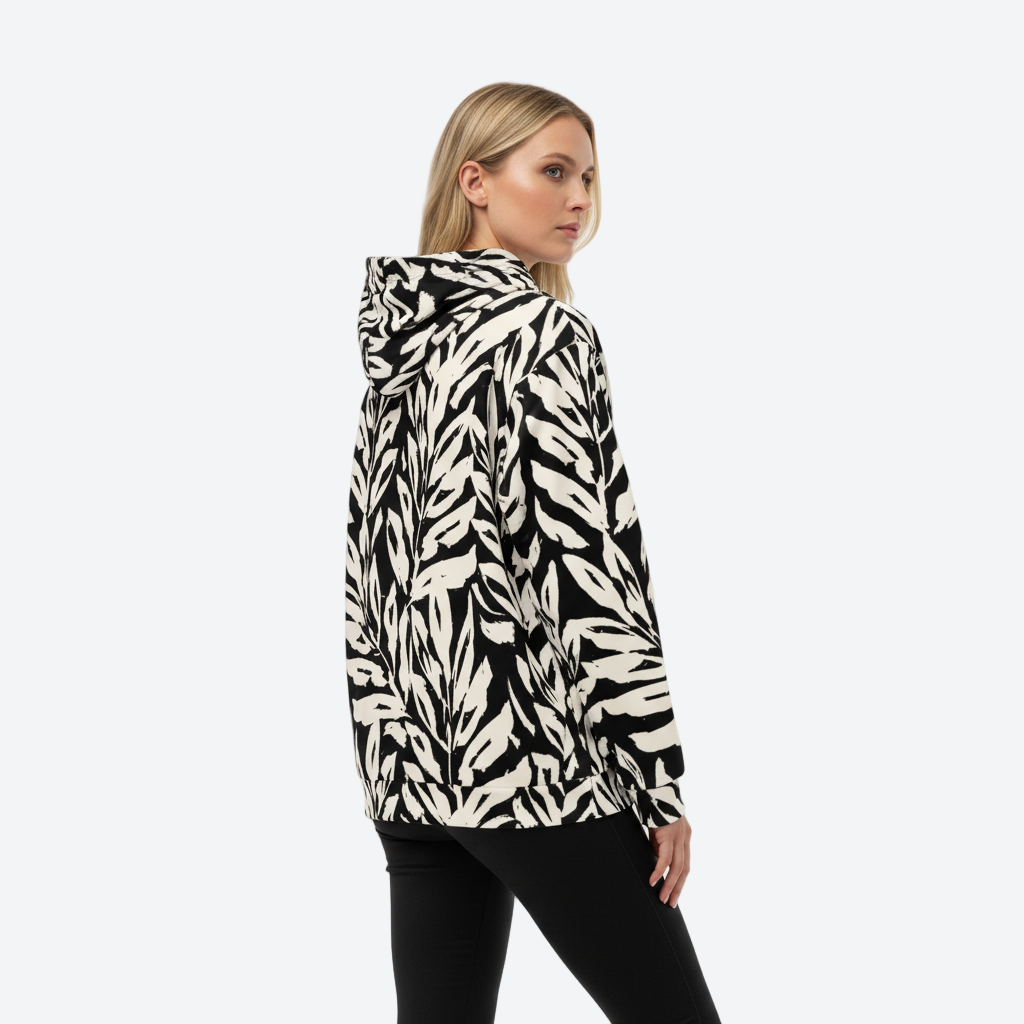 Woman wearing a black and white patterned hoodie on a white background