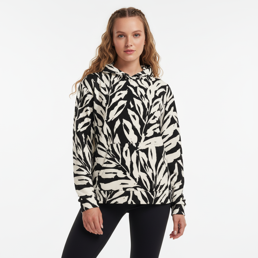 Woman wearing a black and white patterned hoodie on a white background