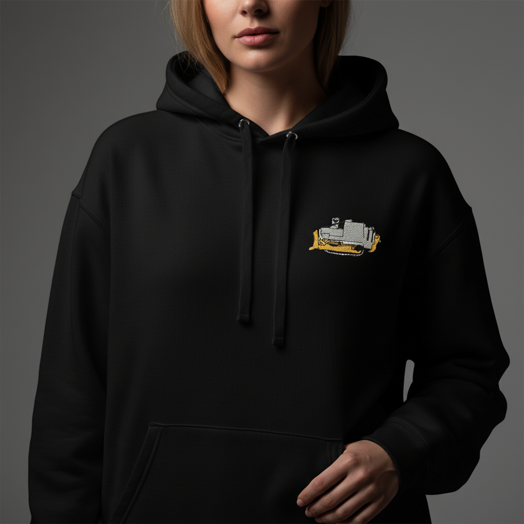 Woman wearing a black The Killdozer Embroidered Hoodie on a gray background