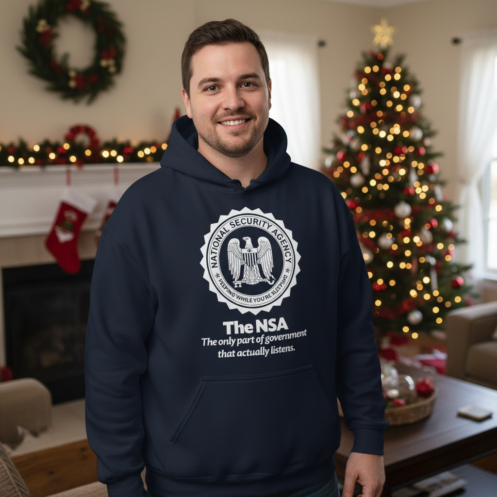 Person wearing a hoodie with NSA logo and text that says The Nsa: The only part of government that actually listens in a festive living room.