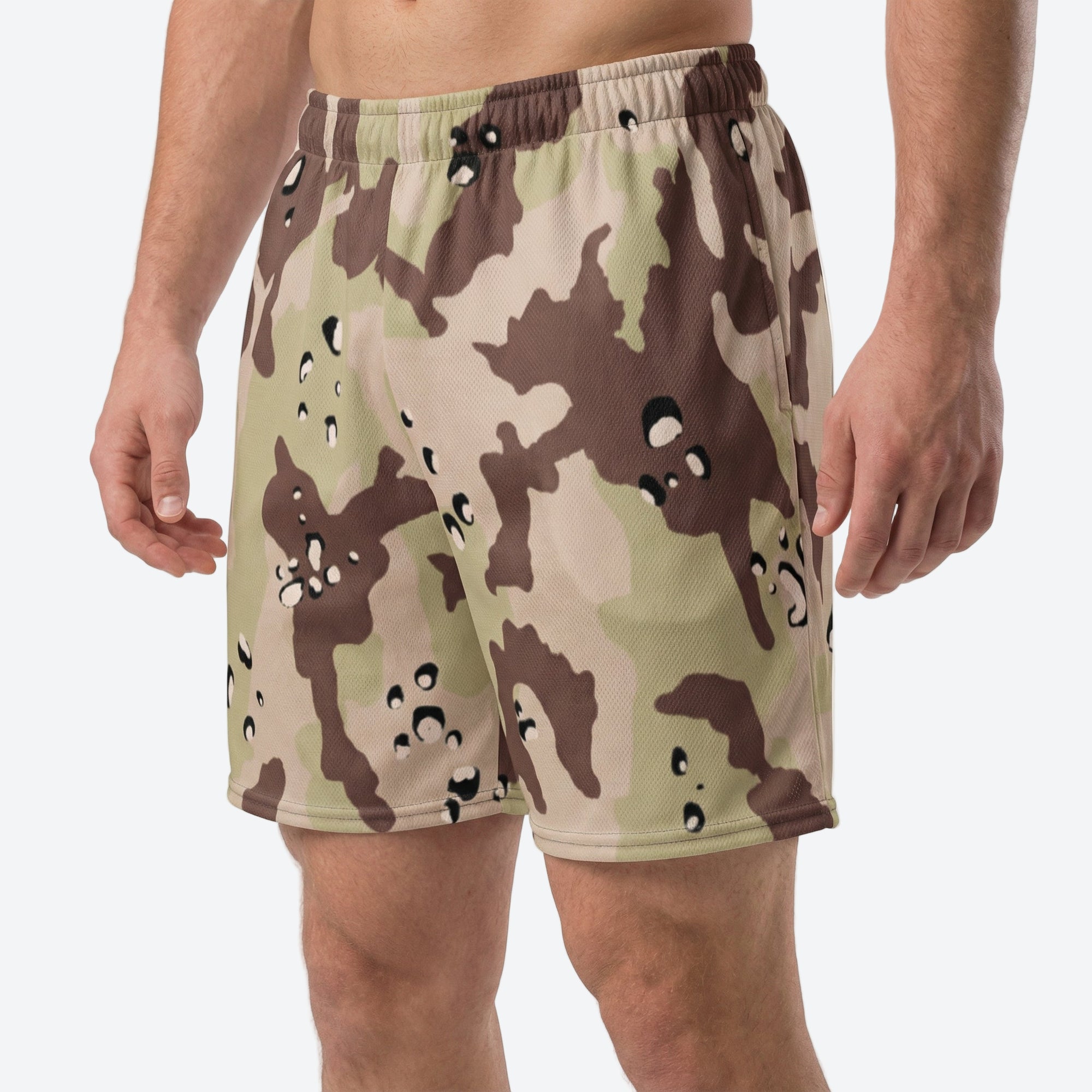 Camouflage shorts worn by a person on a white background