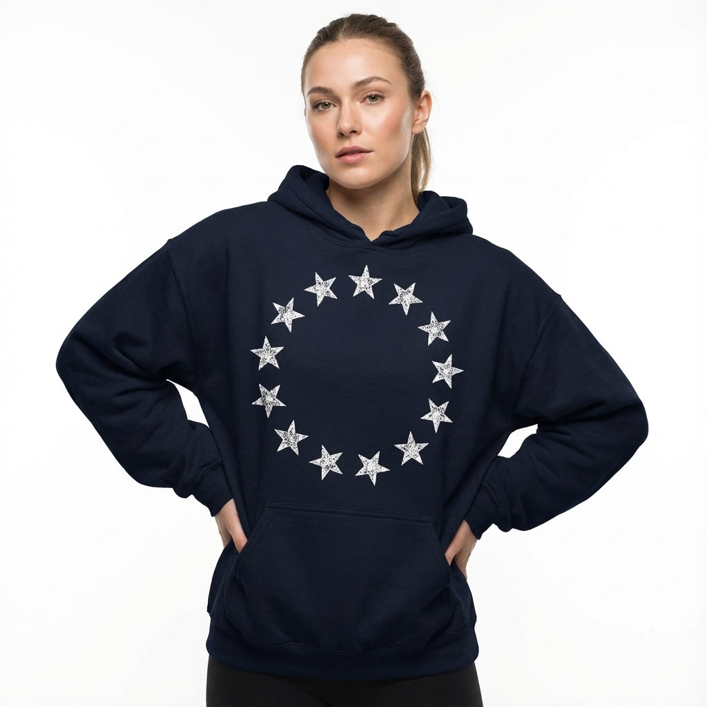 Man wearing a navy blue hoodie with star design on a white background