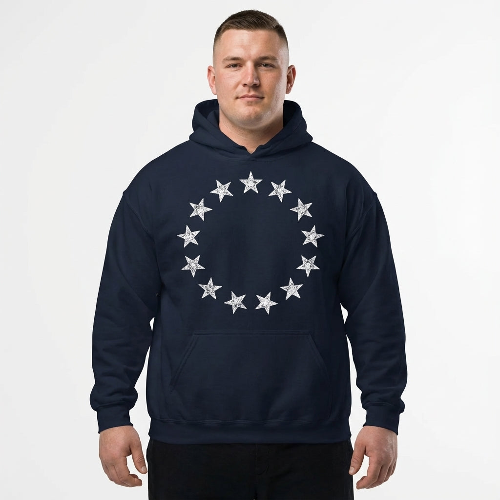 Man wearing a navy hoodie with silver star design on a white background