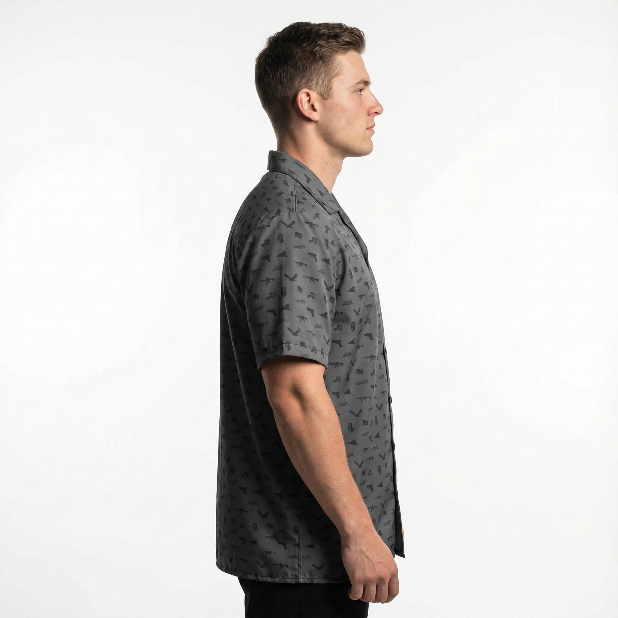 Man wearing a gray patterned shirt on a white background
