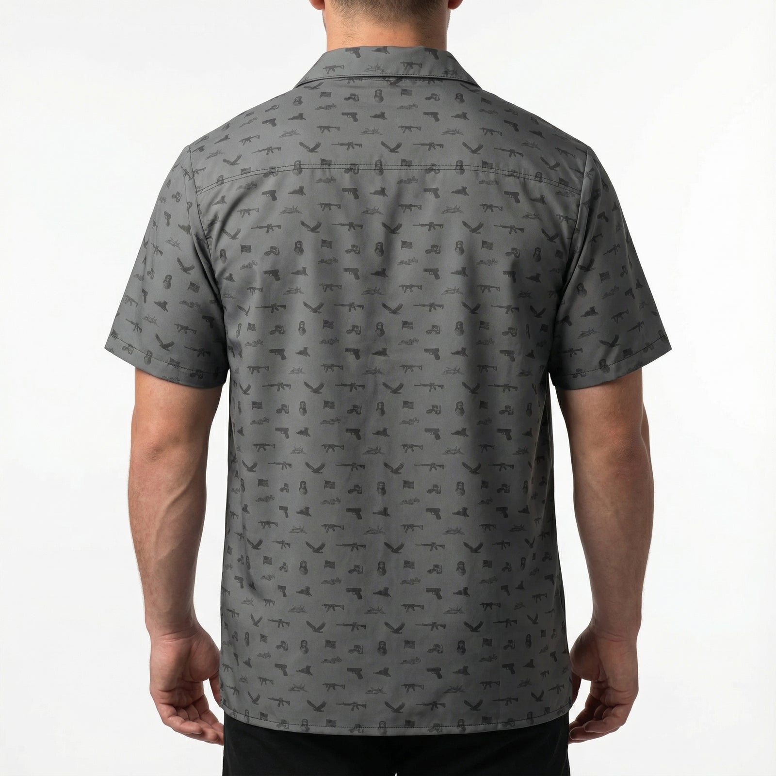 Man wearing a gray patterned shirt on a white background