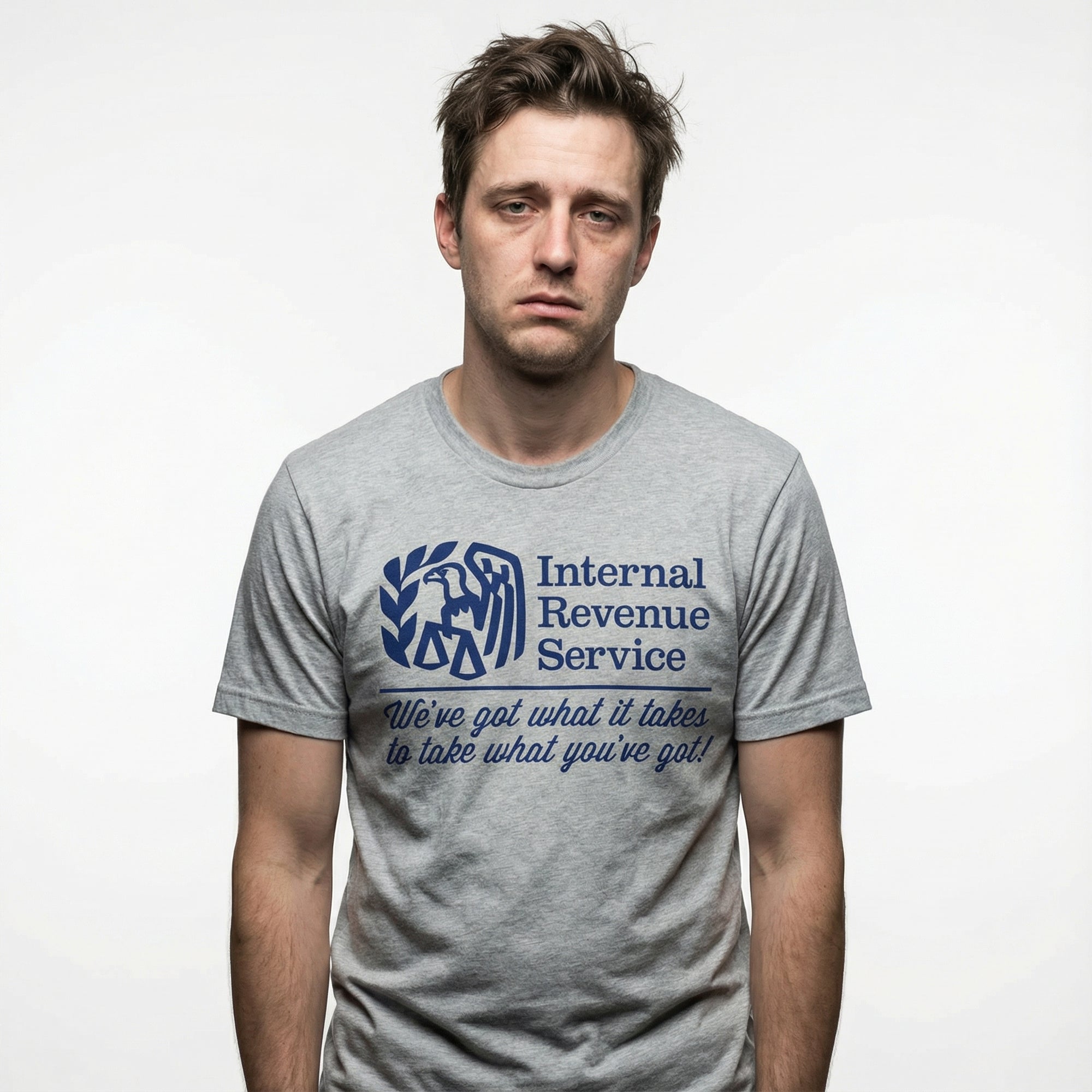 Person wearing a gray t-shirt with Internal Revenue Service logo and text