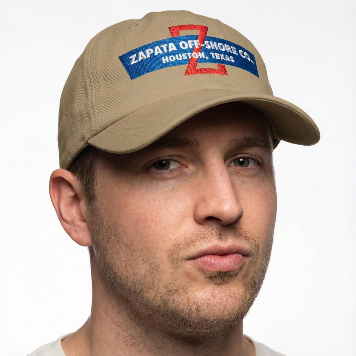 Man wearing a tan cap with Zapata Off-Shore Co logo on a white background