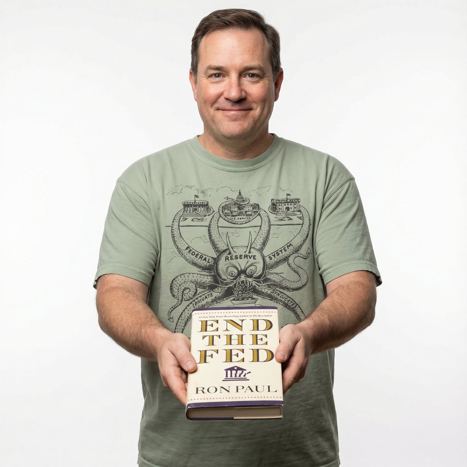 Man holding a book titled 'End the Fed' by Ron Paul against a white background