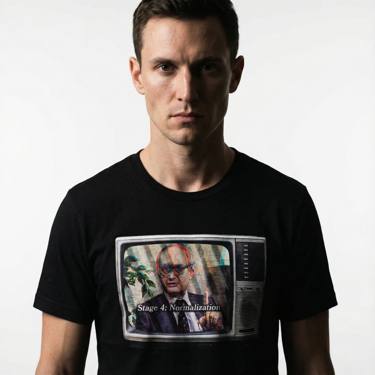 Person wearing a black t-shirt with a graphic design on a white background