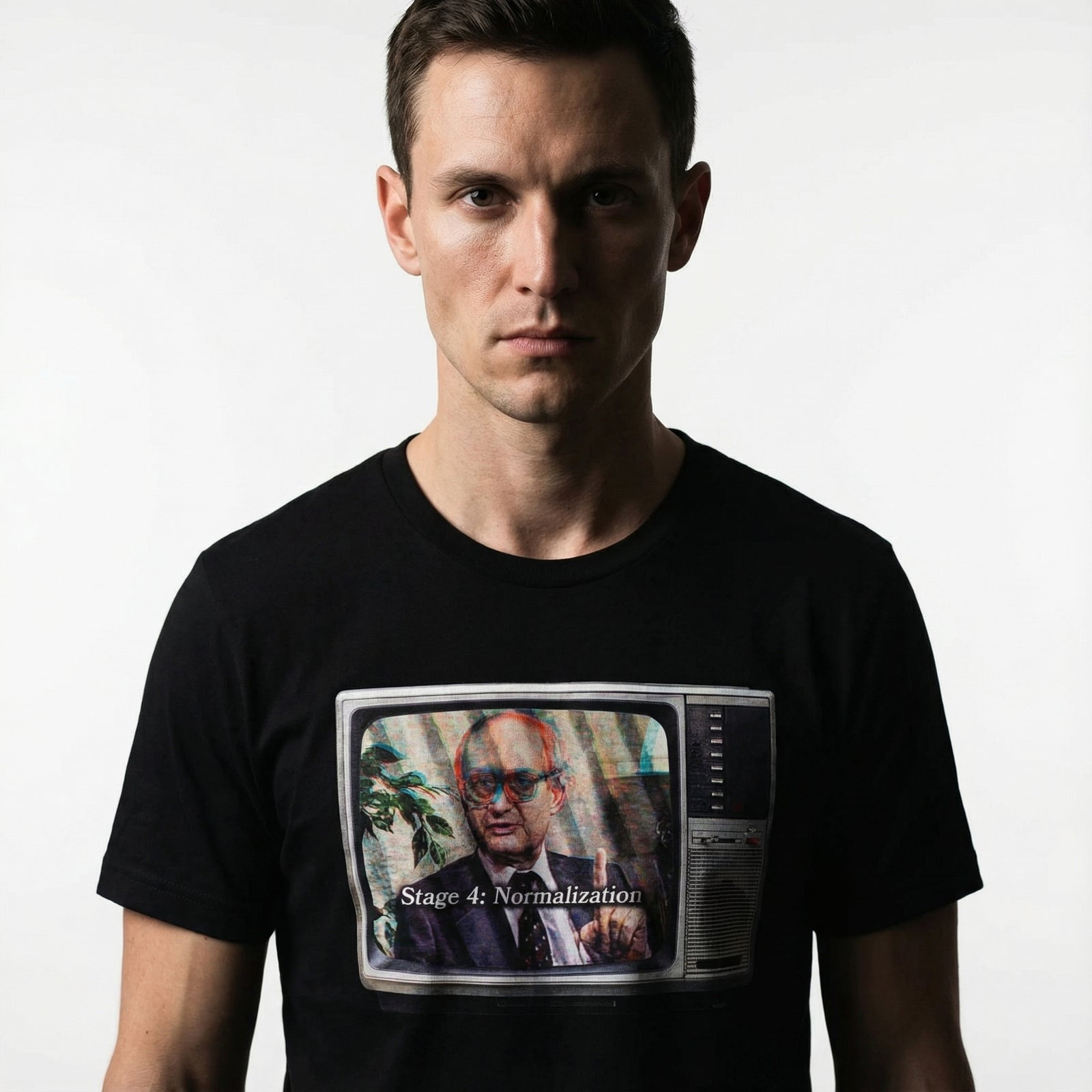 Person wearing a black t-shirt with a graphic design on a white background