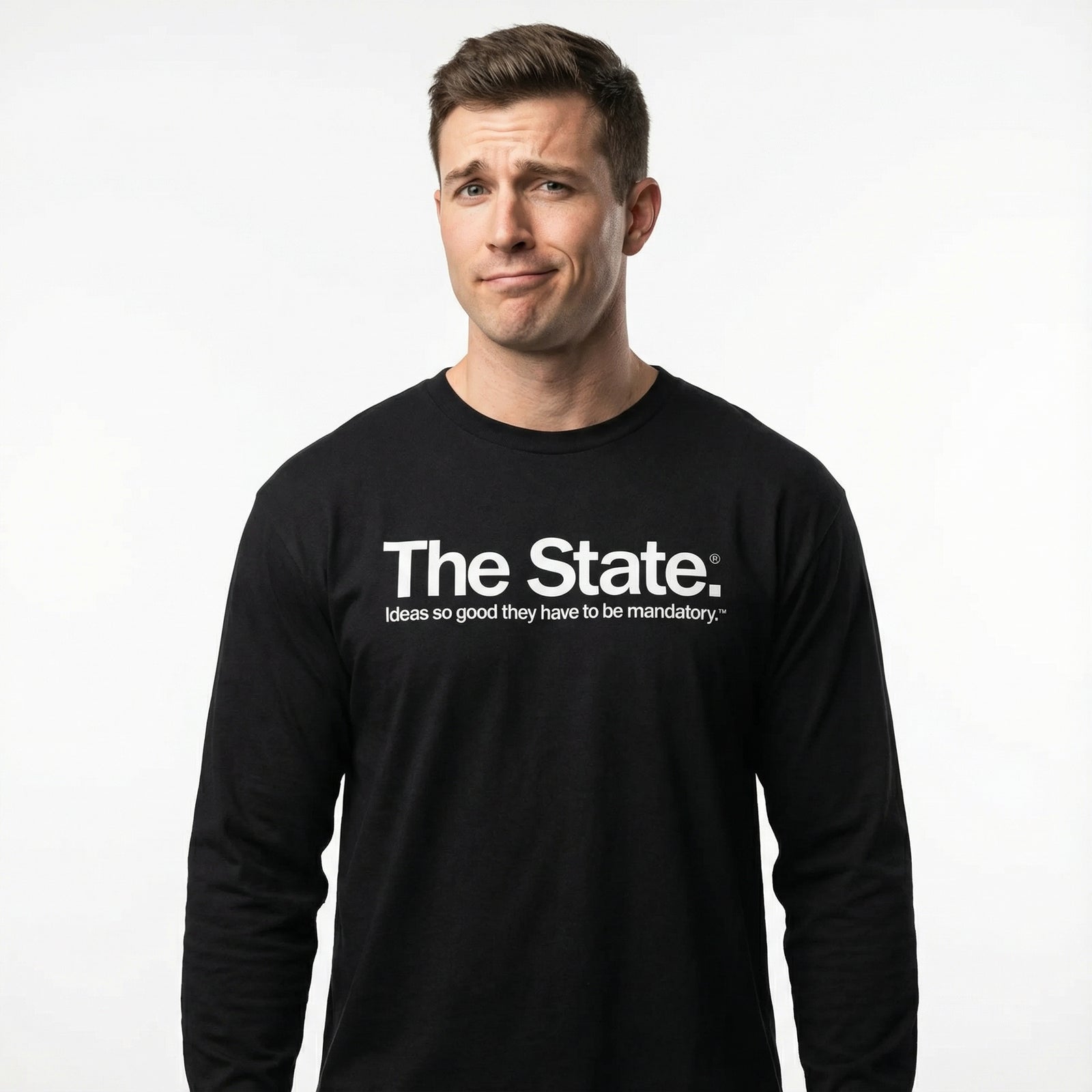 Man wearing a black long-sleeve shirt with 'The State' text on a white background