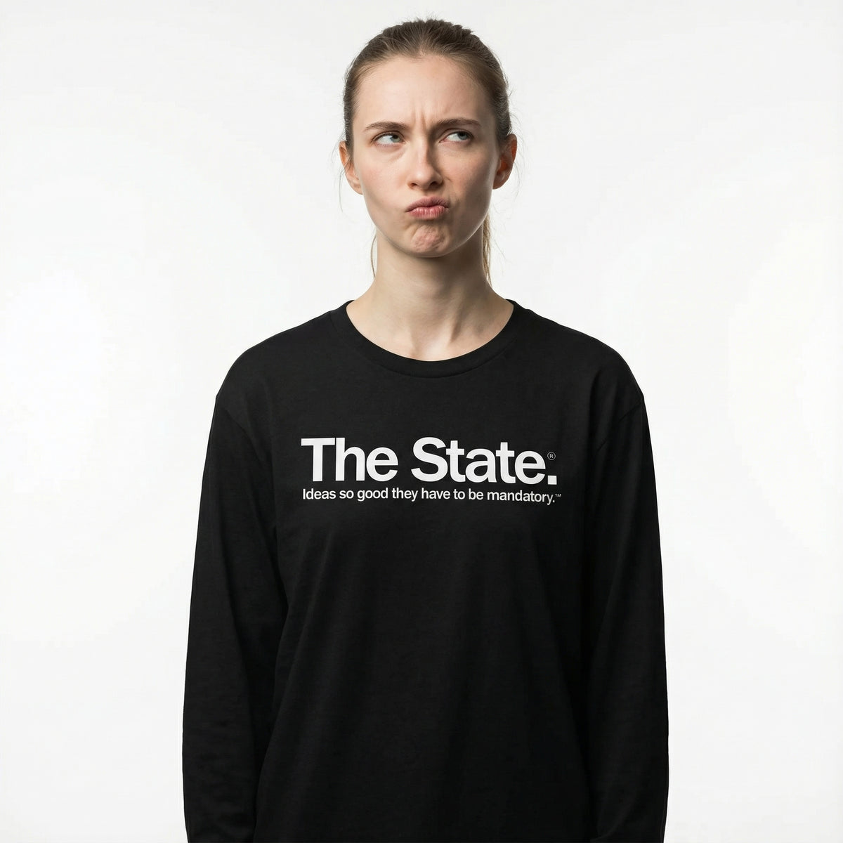 Person wearing a black long-sleeve shirt with 'The State' text on a white background