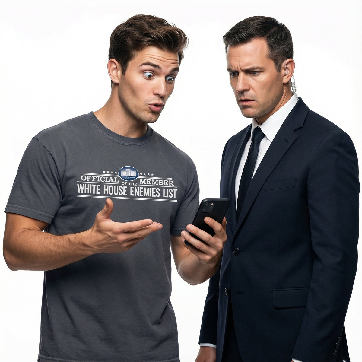 Two men, one in a casual t-shirt and the other in a suit, looking at a phone with a surprised expression.