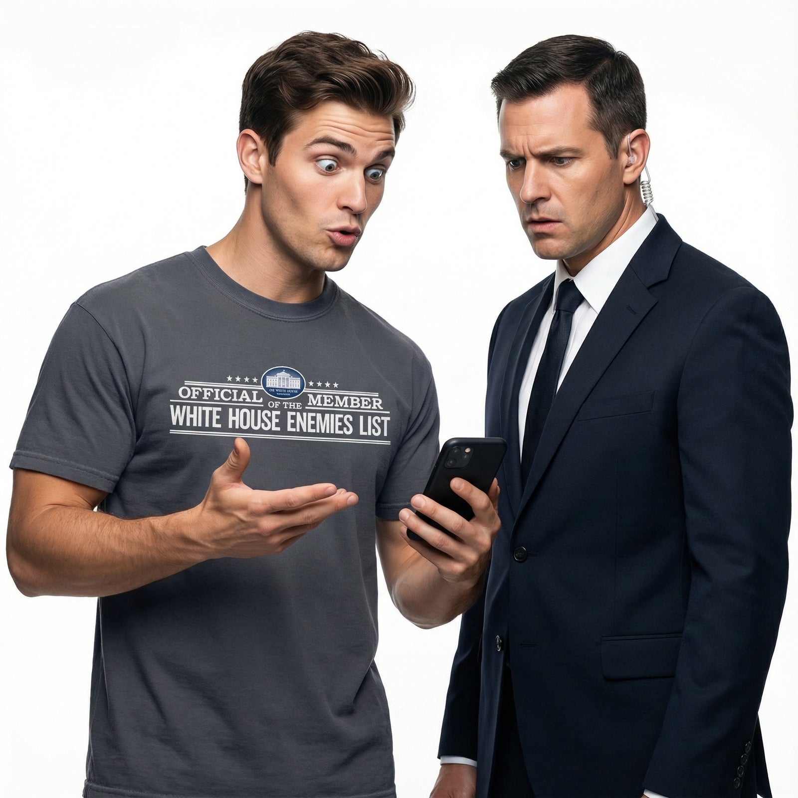 Two men, one in a casual t-shirt and the other in a suit, looking at a phone with a surprised expression.