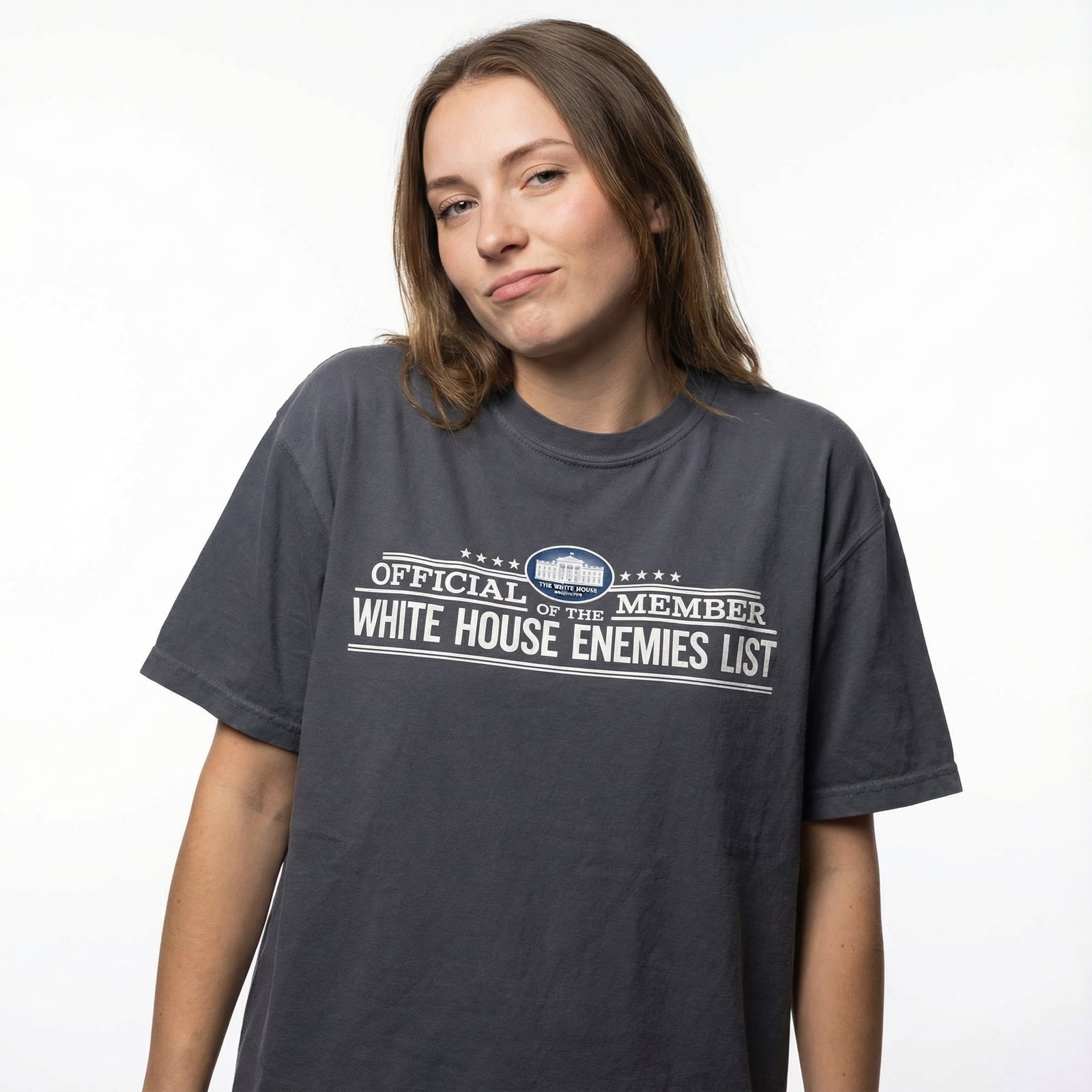 Person wearing a t-shirt with 'Official Member White House Enemies List' text on a white background