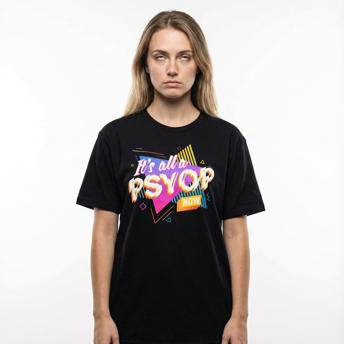 Woman rolling her eyes wearing a black t-shirt with colorful retro text saying "It's all a Psyop Now" on a white background