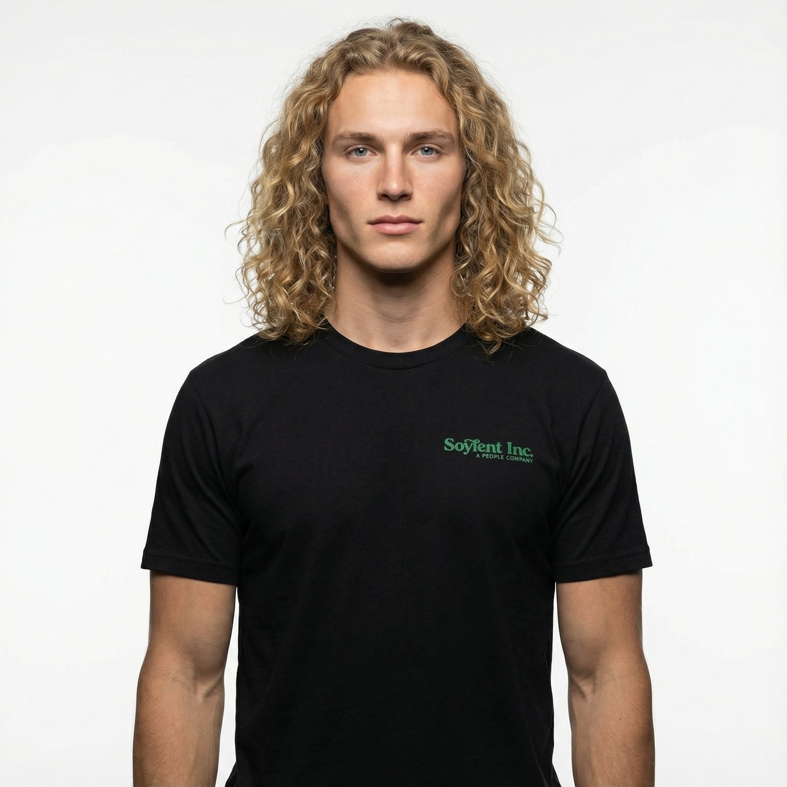 Man wearing a black t-shirt with a green logo on a white background