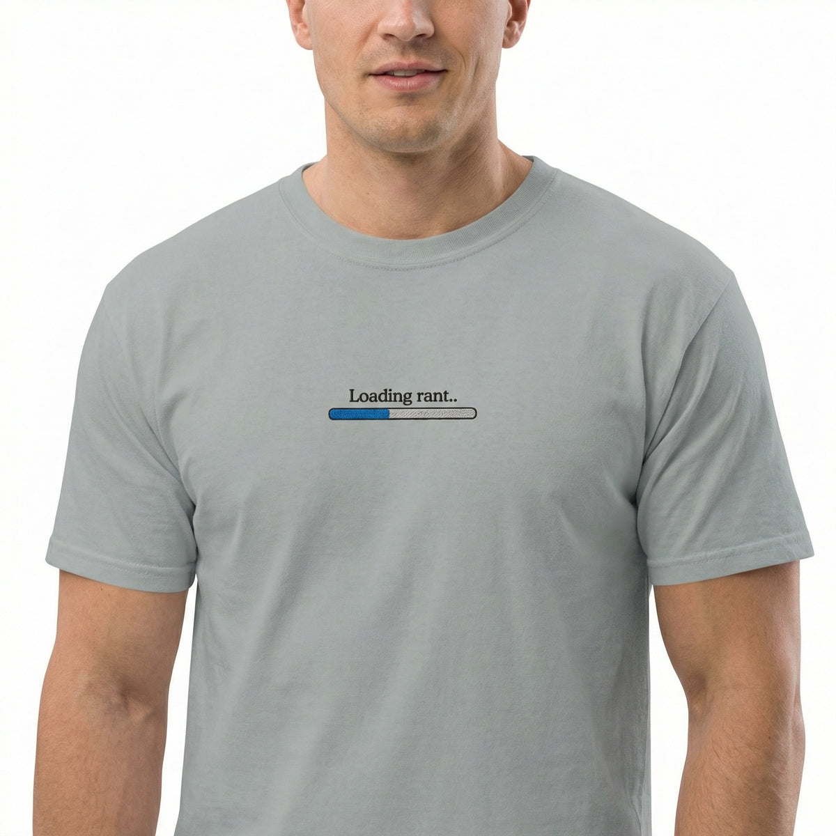 Man wearing a gray t-shirt with a humorous graphic design on a white background