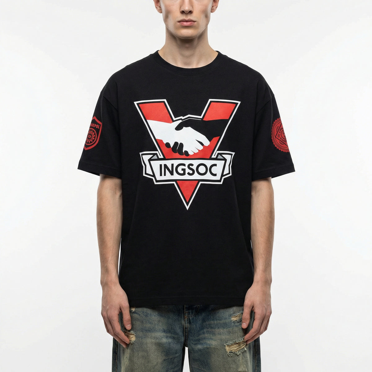 Person wearing a black t-shirt with a red and white logo and text on a white background