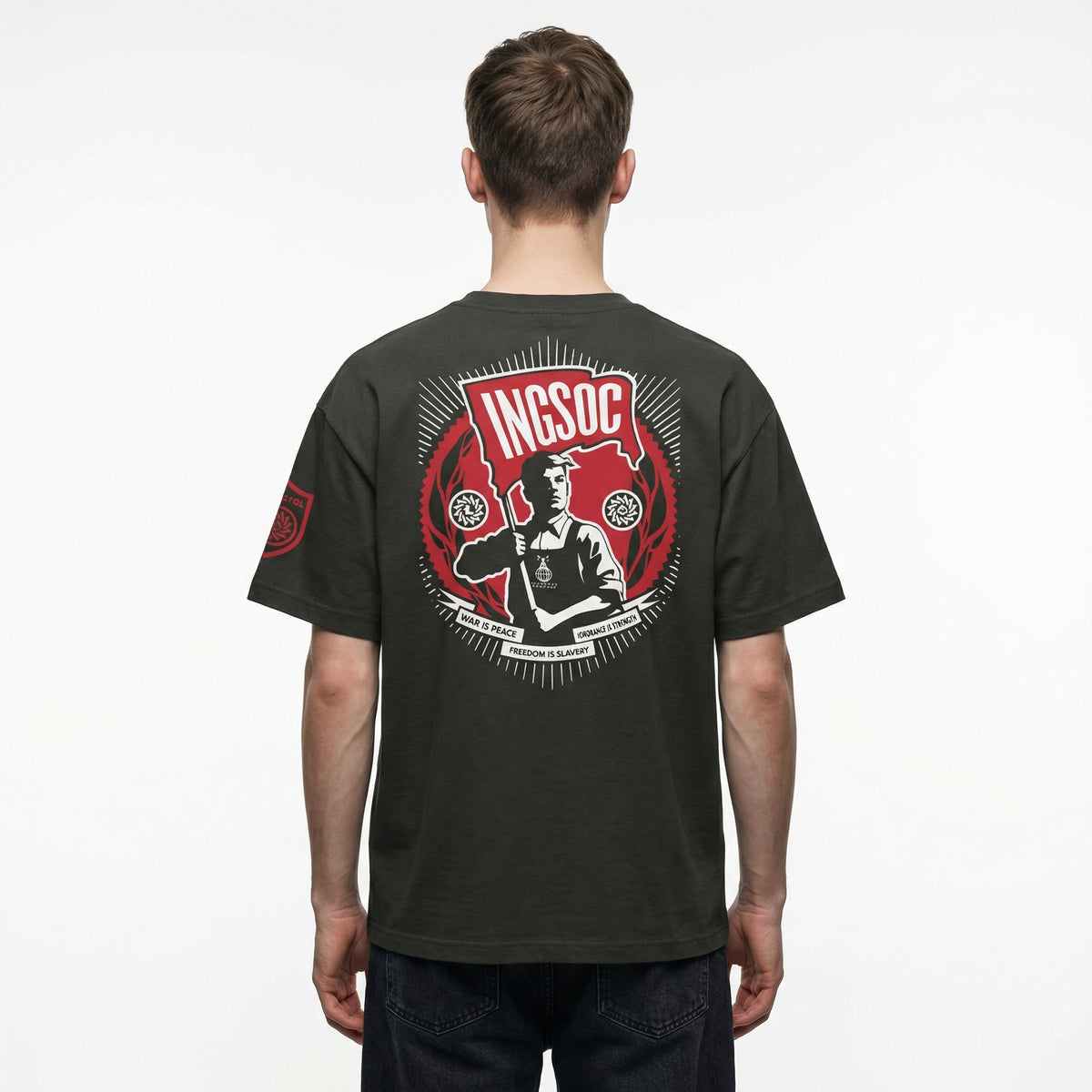 Black t-shirt with a red and white graphic on the back, worn by a person against a white background