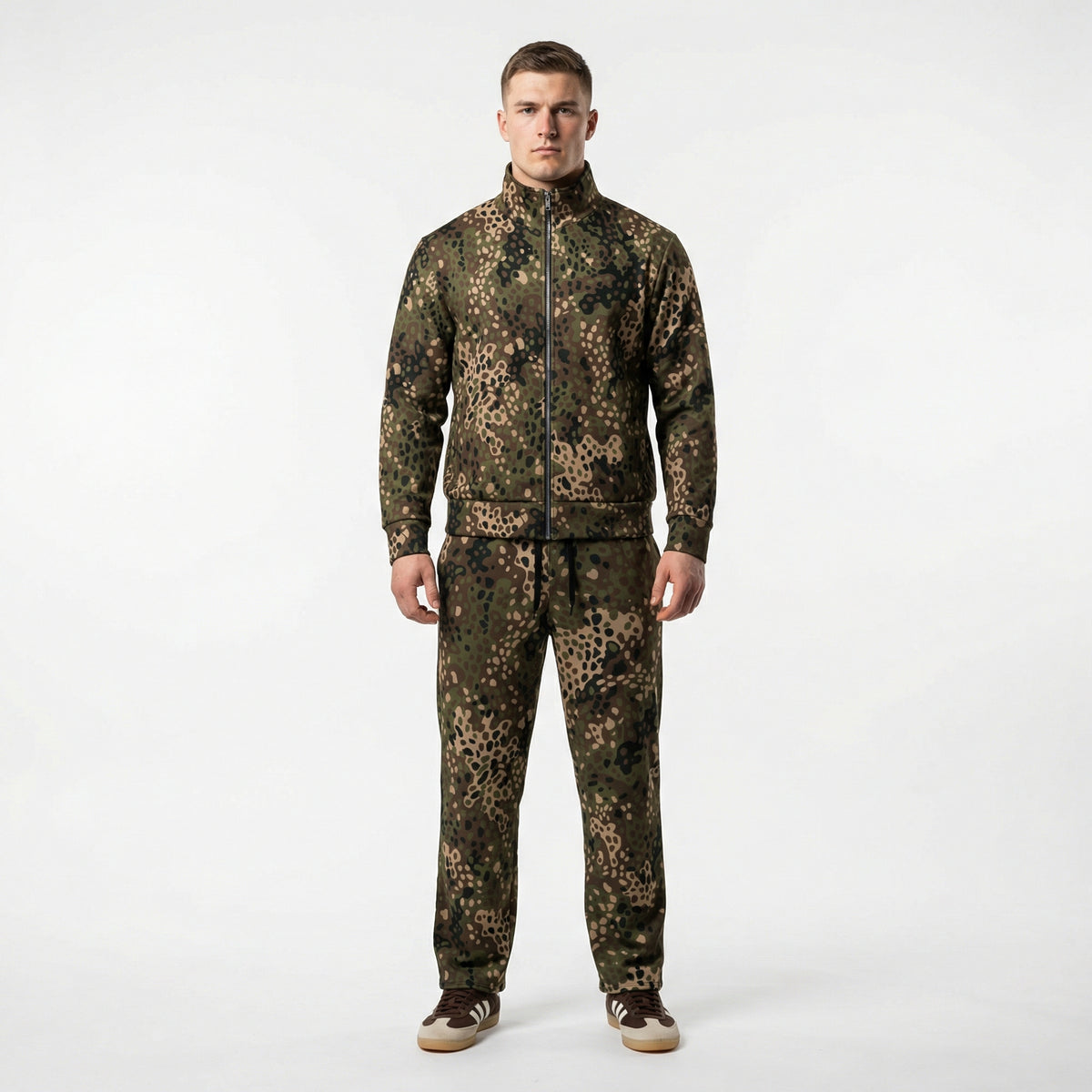 Person wearing a full camouflage outfit on a white background