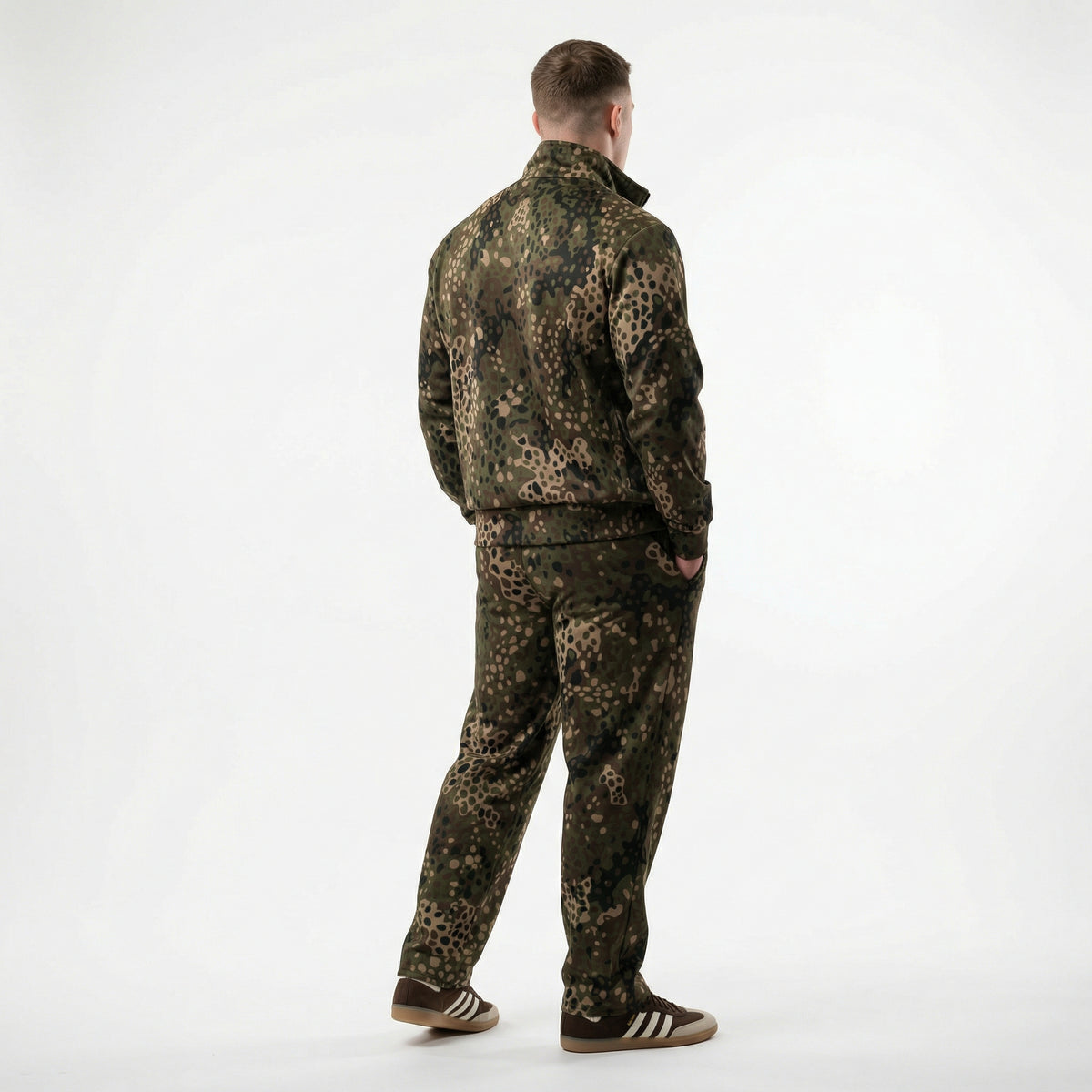 Person wearing a camouflage outfit on a white background