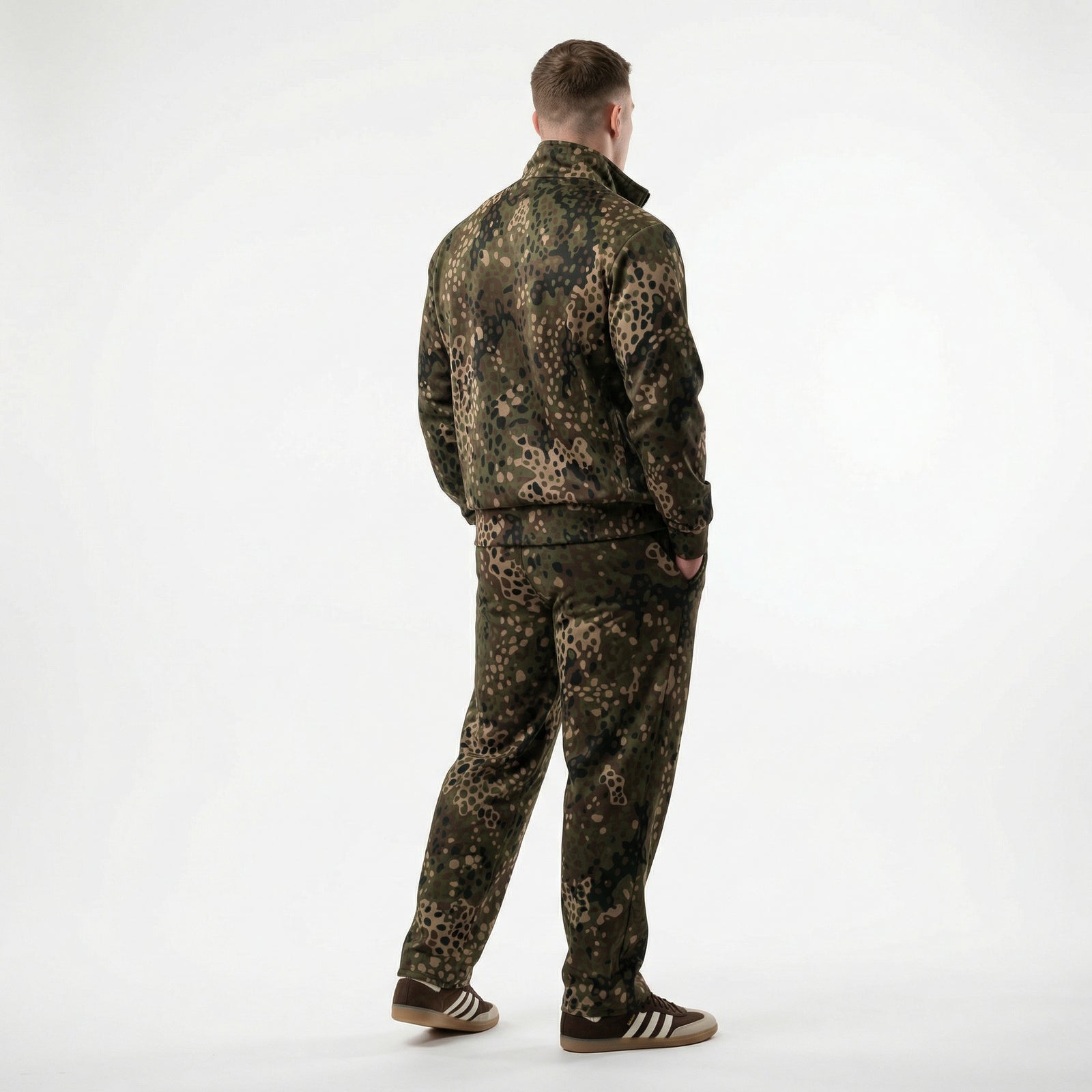 Person wearing a camouflage outfit on a white background