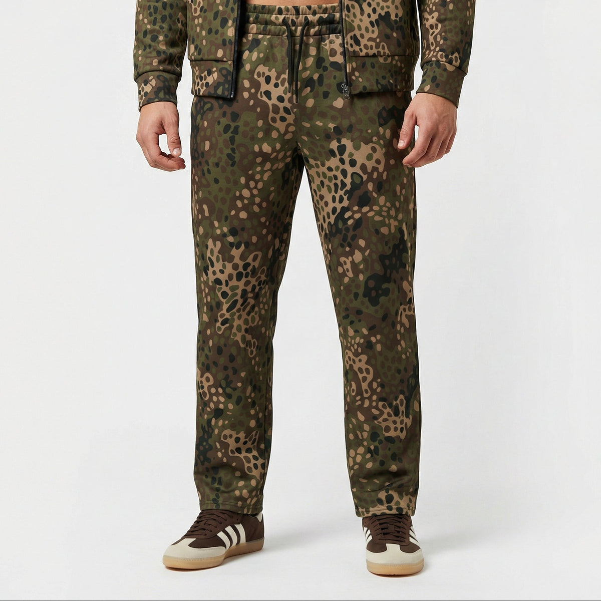 Person wearing a camouflage outfit with a white background