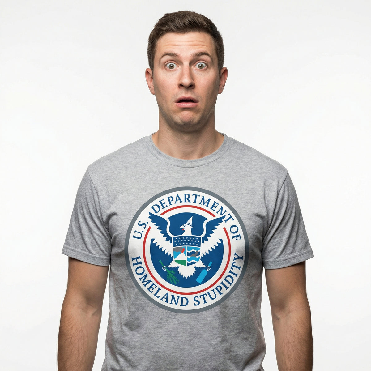 Person wearing a gray t-shirt with a humorous 'Department of Homeland Stupidity' logo.