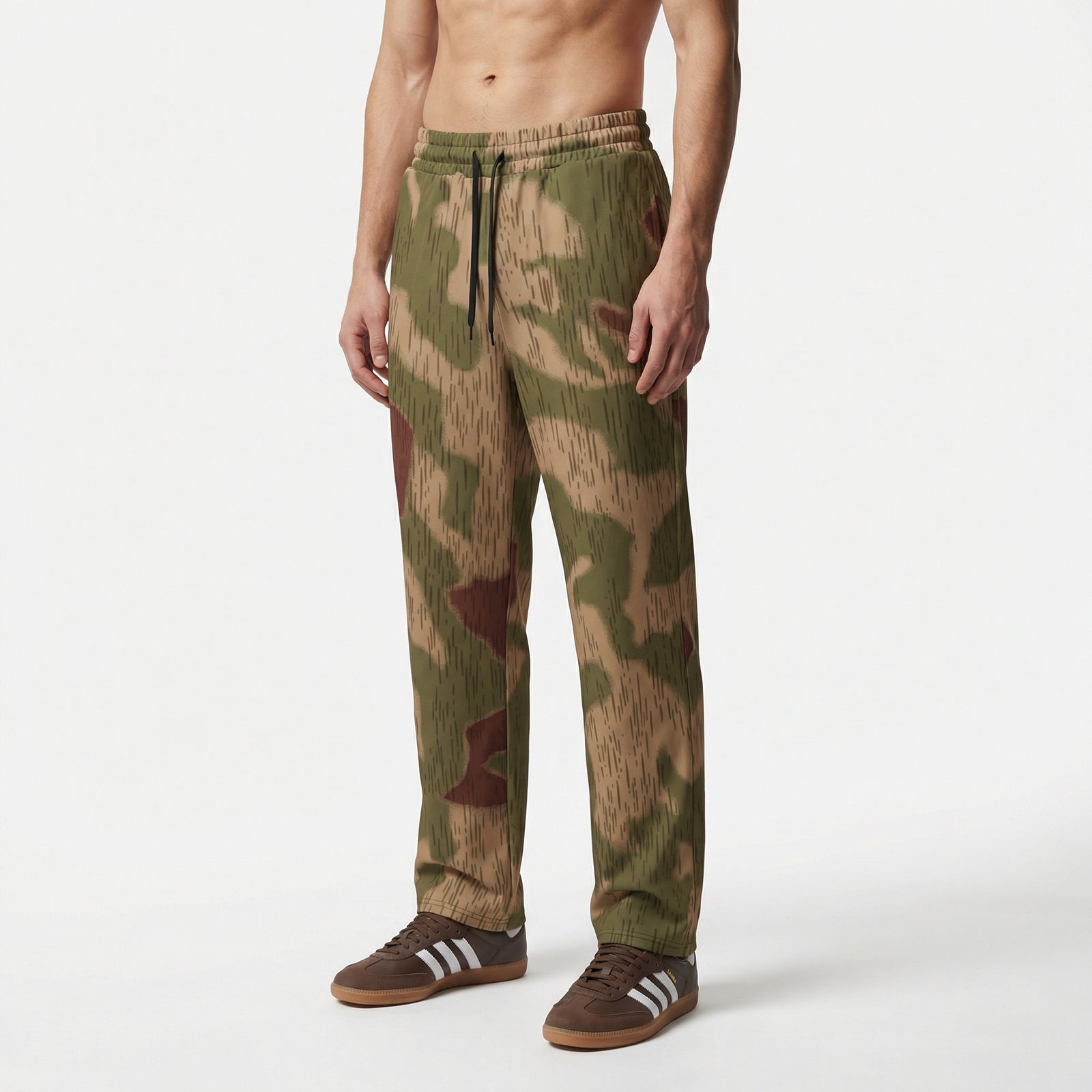 Man wearing Sumpftarnmuster camouflage pants and brown shoes with white stripes on a white background