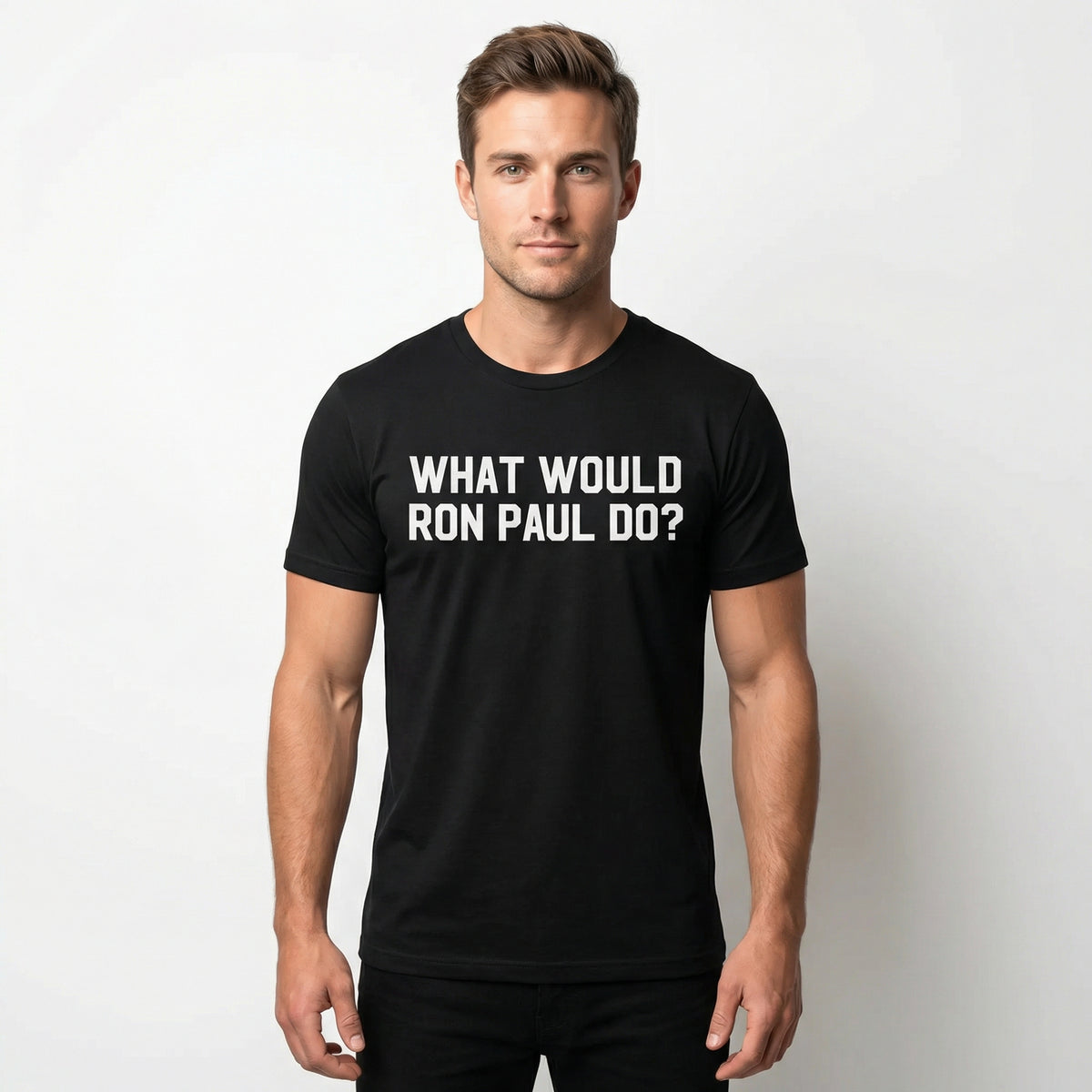 Man wearing a black t-shirt with 'What Would Ron Paul Do?' text on a plain background